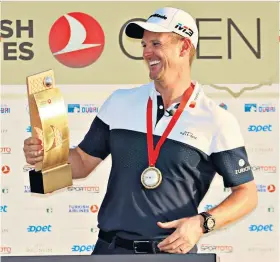  ??  ?? Eyes on the prize: Justin Rose celebrates with the Turkish Airlines Open trophy