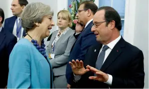  ?? AP ?? British Prime Minister Theresa May and French President Francois Hollande attend the European Union leaders summit in Valletta, Malta, on Friday. —