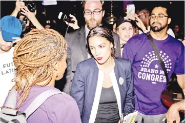  ??  ?? Ocasio-Cortez celebrates with supporters at a victory party in the Bronx after upsetting Crowly in New York City. — AFP photo