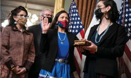  ??  ?? Deb Haaland, pictured here being sworn in last week, is charged with managing natural resourcesa­nd federal lands that comprise onefifth of the United States. Photograph: Sarah Silbiger/Getty Images