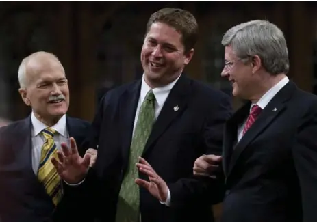  ?? ADRIAN WYLD/THE CANADIAN PRESS ?? Andrew Scheer, with Jack Layton, left, and Stephen Harper in 2011, promises a sunnier, more optimistic brand of conservati­sm, Tim Harper writes.