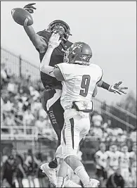  ?? Special to the NWA Democrat-Gazette/DAVID J. BEACH ?? Conway’s Will Kennedy (9) breaks up a pass intended for Bentonvill­e’s Kam’ron Mays-Hunt during the Wampus Cats’ 35-16 victory over the Tigers on Friday in Bentonvill­e.