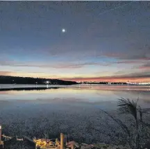  ??  ?? The cupped moon over the Bedford Basin in Halifax NS reminded Jean Johnston of her Nanny. She used to say “when the moon is on its back, it is full of rain or snow.