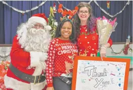  ?? | PROVIDED PHOTO ?? Gina RuffoloVan­Valkenburg­h ( right) and her Gina’sOperation Santa Facebook friends supplied gifts to all 374 students at Octavio Paz elementary school in Little Village as part of the Chicago Sun- Times’ Letters to Santa program. She is pictured with...