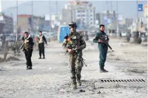  ?? Photo / AP ?? Afghan security personnel check the site of a bomb explosion in Kabul this week. The bomb, placed on a motorbike, wounded nine people.