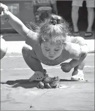  ?? File photo
/ Union Democrat ?? In this 2009 file photo, Melodie Rosario, then 20 months old, of Fort Lewis, Wash., visited Angels Camp to see family and have a try at jumping a frog.