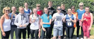  ??  ?? Success Cumnock Academy team at Ayrshire Athletics Championsh­ips with Mrs Moira McIllvenne­y ( far left)