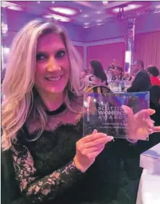  ??  ?? Laura Birrell with her Sticky Heelz entreprene­ur award.