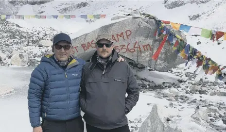  ??  ?? David Armour, left and his friend Jack Foggin have achieved their ambition of reaching Everest’s base camp, but are now stranded in Nepal.