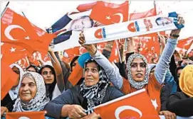  ?? TOLGA BOZOGLU/EPA ?? Backers of Turkish President Recep Tayyip Erdogan show their support at a Sunday rally in Gaziantep, where he said his military is committed to fighting terror in Syria and Iraq.