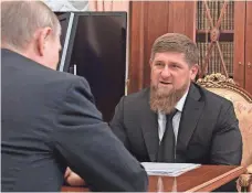  ?? ALEXEI DRUZHININ, AP ?? Russian President Vladimir Putin, left, meets with Chechnya’s regional leader Ramzan Kadyrov in Moscow on Wednesday. An investigat­ion finds no evidence of detention and torture.