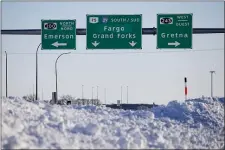  ?? JOHN WOODS — THE CANADIAN PRESS VIA AP ?? Road signage is posted just outside of Emerson, Manitoba on Thursday, Jan. 20, 2022.