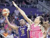  ?? Ross D. Franklin
Associated Press ?? NNEKA OGWUMIKE, left, trying to fend off Brittney Griner last year, will be a Sparks mainstay again.