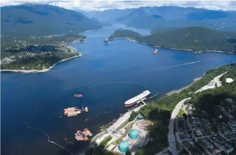  ?? CP FILE PHOTO ?? A tanker is docked at Kinder Morgan’s Trans Mountain marine terminal in Burnaby on May 29. The National Energy Board review of the proposed expansion of the pipeline will examine the impacts of the project out to about 12 nautical miles from the coast.