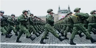  ??  ?? FIGHT RISK At left, Putin attends a joint Russian and Belarusian military exercise in 2017. Above, a military parade in Moscow's Red Square marking a World War II anniversar­y. U.S.Russian relations are at their lowest point since the Cold War, making the risks of even a small incident escalating into con  ict dangerousl­y high.