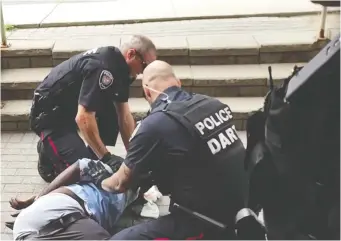  ??  ?? In 2016, the former DART unit was thrust into the spotlight after the death of Abdirahman Abdi, a mentally ill Somali-Canadian, which reignited tensions between the Ottawa police unit and racialized communitie­s.