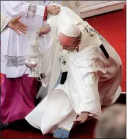  ?? AP/GREGORIO BORGIA ?? Pope Francis stumbles Thursday as he was celebratin­g Mass in Czestochow­a, Poland. The pontiff is on a visit to Poland and today will tour the Nazi death camp Auschwitz-Birkenau, where some 1.1 million people were killed.