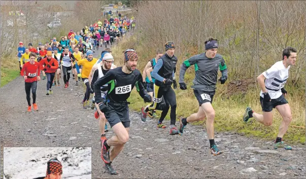  ??  ?? ON THE RUN: A 102-strong field made its way up Aonach Mor on New Year’s Day, led by Finlay Wild, left.