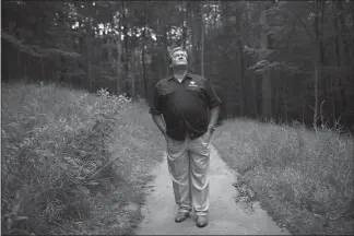  ?? MADDIE MCGARVEY / THE NEW YORK TIMES ?? Brad Sussman, an insurance salesman, looks toward the sky near his home in Parma, Ohio. No state has more lightning than Florida, where Sussman worked as a meteorolog­ist when a strike hit his porch. “I knew everything about lightning,” said Sussman, who was thrown 18 feet but left with only minor injuries — and a healthier respect for lightning.