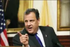  ?? MEL EVANS — THE ASSOCIATED PRESS FILE ?? In this file photo, New Jersey Gov. Chris Christie reacts to a question after announcing Deborah Gramiccion­i is replacing Bill Baroni as deputy executive director of The Port Authority of New York &amp; New Jersey following Baroni’s resignatio­n that day, during a news conference at the Statehouse in Trenton, N.J. The colorful, candid, at-times crude and historical­ly unpopular two-term Republican governor, who captured national headlines with his unique turns-of-phrase and gigantic personalit­y, leaves office Tuesday.
