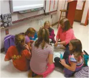  ??  ?? Northside Elementary teacher Lawana Gurley oversees one team of students building their Lego robot during Robotics Club Thursday.