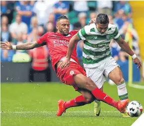  ??  ?? City’s Danny Simpson tackles Celtic’s Emilio Izaguirre.