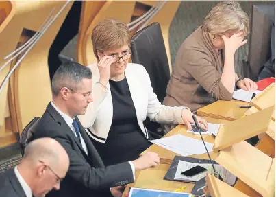  ?? Picture: PA. ?? Nicola Sturgeon after Finance Secretary Derek Mackay’sspeech during a Budget debate.