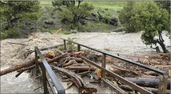  ?? NATIONAL PARK SERVICE VIA AP ?? Flooding washed out a bridge at Rescue Creek in Yellowston­e National Park, Mont., on Monday.