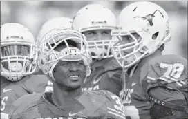  ??  ?? Texas’ Johnathan Gray (center), with 683 yards and a 4.8 per-carry average, has become the Longhorns’ top running back. Gray and Malcolm Brown figure to get most of the carries against Oregon State in the Alamo Bowl.