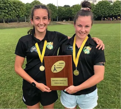  ?? Photo: Contribute­d ?? DYNAMIC DUO: Chloe Cocks (left) and Holly Anlezark celebrate their Paris World Games Rugby Sevens victory. The University Saints and West Bulldogs duo were part of the Tribe Rugby Sevens representa­tive team that went through the competitio­n undefeated.