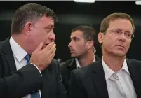  ?? (Flash90) ?? LABOR PARTY chairman Avi Gabbay (left) speaks with his predecesso­r, MK Isaac Herzog, during the party’s convention yesterday in Tel Aviv.