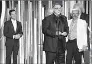  ?? AP/NBC/PAUL DRINKWATER ?? Producer Graham King accepts the award for best motion picture drama for Bohemian Rhapsody at the Golden Globes ceremony Sunday in Beverly Hills, Calif. At left is Rami Malek, who won best actor in a drama for his portrayal of Freddie Mercury.