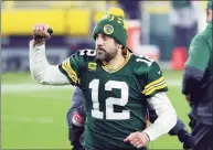  ?? Stacy Revere / Getty Images ?? Aaron Rodgers of the Green Bay Packers celebrates defeating the Los Angeles Rams 32-18 in the NFC divisional playoff game at Lambeau Field on Jan. 16 in Green Bay, Wis.