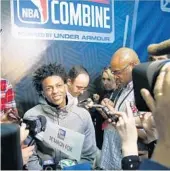  ?? CHARLES REX ARBOGAST/ASSOCIATED PRESS ?? Former Kentucky point guard De’Aaron Fox, center, fields questions at the NBA draft combine Friday in Chicago.