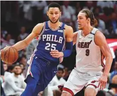  ?? USA Today Sports ?? ■ Philadelph­ia 76ers guard Ben Simmons (25) is guarded by Miami Heat forward Kelly Olynyk during the first half in game four of the first round of the NBA Play-offs.