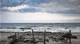  ?? Salwan Georges / Washington Post ?? The foundation of a house that used to sit along the water near Carpenter Beach is seen in May 2019 in South Kingstown, R.I.