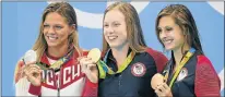  ?? Picture: EPA ?? RACE CONTROVERS­Y: Gold medalist Lilly King, of USA, centre, is flanked by silver medalist Yulia Efimova, left, of Russia, and bronze medalist Katie Meili, of USA, during the medal ceremony for the women’s 100m breaststro­ke final