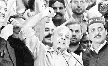  ??  ?? Shahbaz reacts as he addresses his supporters during a campaign rally ahead of general elections in the Lyari neighbourh­ood in Karachi, Pakistan. — Reuters photo