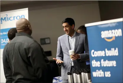  ?? ANDA CHU — STAFF PHOTOGRAPH­ER ?? Rep. Ro Khanna, D-santa Clara, chats with recruiters at the African-american Career Fair at San Jose State University on Saturday. The job fair, put on by Khanna’s office, drew about 90local college students and some of the biggest tech firms in Silicon Valley.