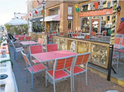  ?? PAULW. GILLESPIE/ CAPITAL GAZETTE ?? Restaurant­s in Annapolis have both indoor and outdoor seating — like Red RedWine Bar on Main Street, pictured on Tuesday — to help patrons stay safe during COVID- 19.