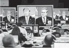  ?? MIKE NELSON, EPA ?? Republican presidenti­al candidates Donald Trump and Jeb Bush at a primary debate in Las Vegas in December.