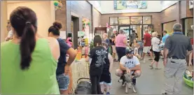  ?? John Popham ?? The line to adopt pets spanned across the lobby of the PAWS facility Saturday morning.