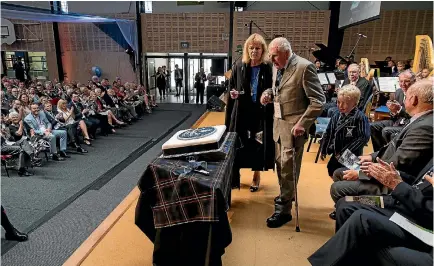  ?? PHOTO: ALDEN WILLIAMS/FAIRFAX NZ ?? The birthday cake was cut by old boy Naylor Hillary and his grandson and current year two student Henry Bissland, right, at the St Andrew’s College 100th Founders’ Day.