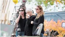  ?? KRIS DUBE TORSTAR ?? Tillie Clapp is flanked by daughters Jodie and Eilsha during a procession held Monday in honour of her husband Earl, who was killed last week near their rural Fenwick property.