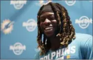  ?? TIM IRELAND — THE ASSOCIATED PRESS FILE ?? In this Sept. 29 photo, Miami Dolphins running back Jay Ajayi laughs during a press conference after a training session at Allianz Park in London. The NFL-leading Eagles have bolstered their offense by acquiring running back Jay Ajayi from the Miami...