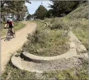  ?? ?? Chris Prentiss of Mill Valley rides down the Marincello Trail next to a curb in the Tennessee Valley recreation area in Mill Valley on March 2. Various upgrades have been done.