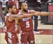  ?? KYLE FRANKO — TRENTONIAN PHOTO ?? Rider’s Dwight Murray Jr., right, and Allen Powell, left, talk during a break in the action against Monmouth during a MAAC game at Alumni Gymnasium on Friday afternoon.