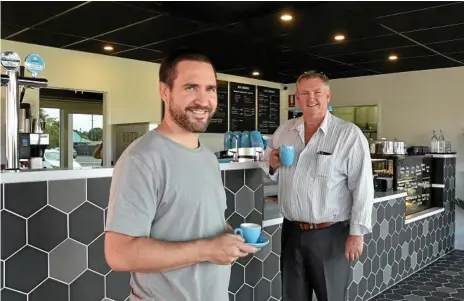  ?? Photo: Bev Lacey ?? NOW BREWING: Sleepless City Coffee Roasters owner Tim Burstow (left) and Raine and Horne agent Nick Koenig celebrate the opening of its second store in Toowoomba.