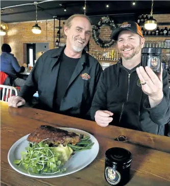  ?? CLIFFORD SKARSTEDT/EXAMINER ?? Co-owner Terry Coughlan of Jus-Jellin, left, with co-owner and executive chef Brad Watt taking a break at the Publican House Restaurant and Taphouse on Thursday. Jus-Jellin produces gourmet beer jelly using Publican House Brewery suds.