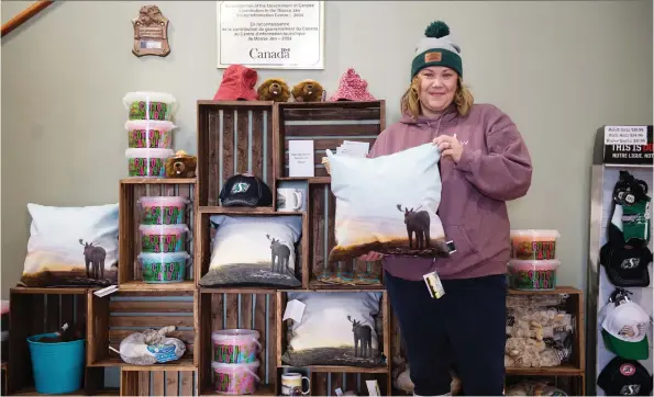  ?? PHOTOS: BRANDON HARDER ?? Jacki L’heureux-mason, executive director of Tourism Moose Jaw, holds a pillow bearing a design based on a photograph she took of Mac the Moose. She’s hoping the recent internatio­nal media attention on Moose Jaw will translate to a booming tourist season this year. The art on the pillow was done by Yvette Moore.